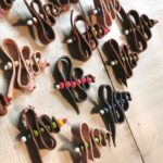 Handmade leather Christmas tree brooch. In-house brick by Iwona Luka