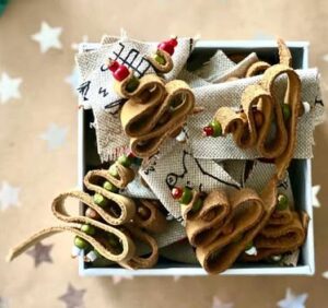 Handmade leather Christmas tree brooch. In-house brick by Iwona Luka