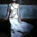 Bridal fashion by Iwona Luka. Wedding dress with a lacy accessories